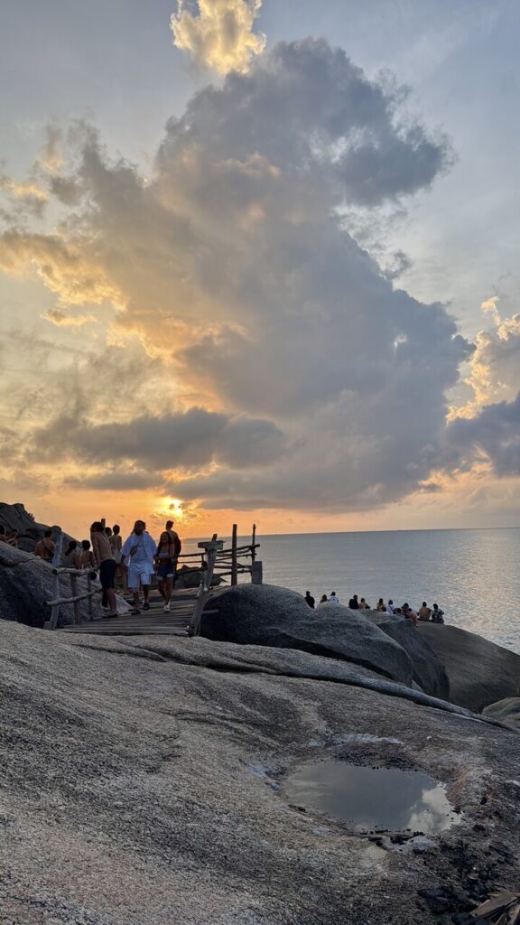 Rocky cliff with people watching the sunrise, best things to do in Koh Phangan