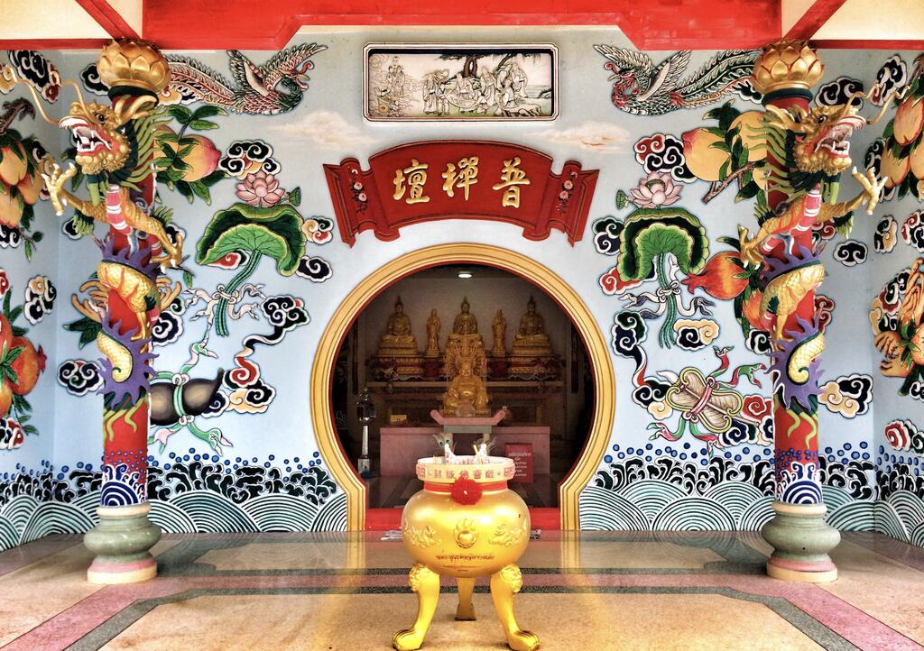 Colorful temple entrance with sculptures.