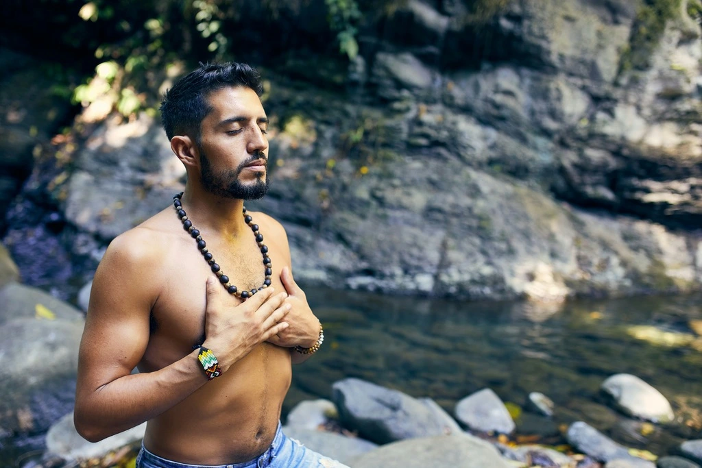 31 Best Things to Do in Koh Phangan: 2025 Guide 11 A man with a beard and a necklace meditating.