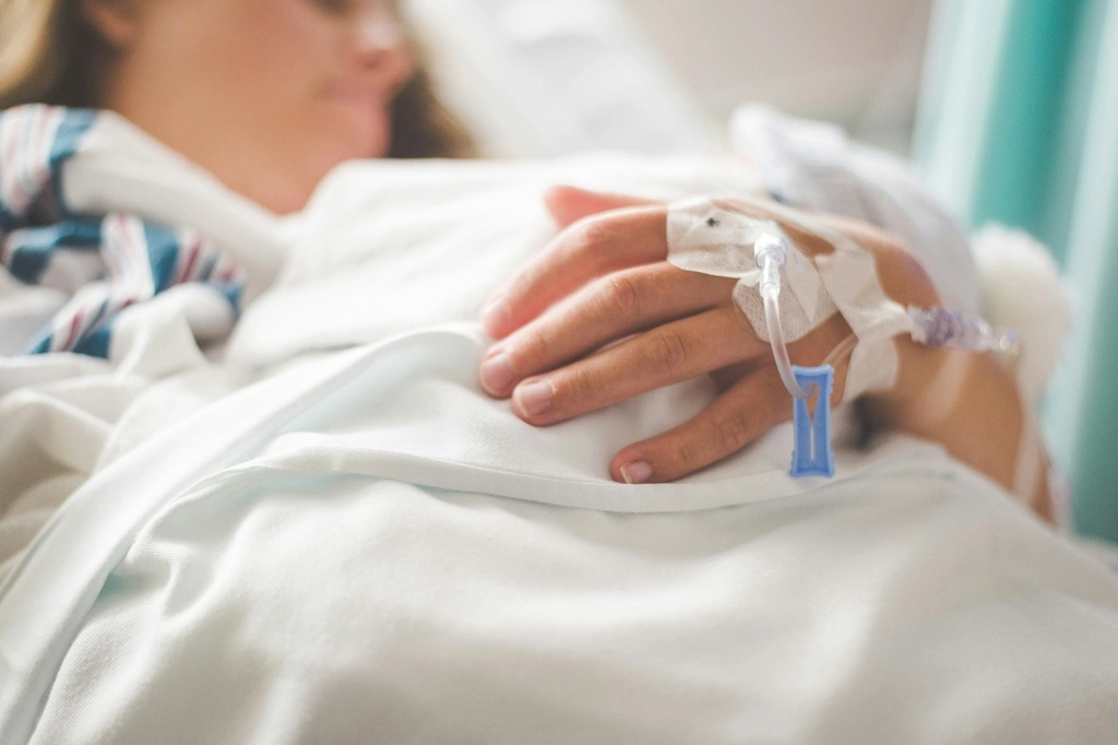 Woman in hospital bed