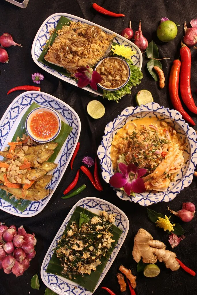 31 Best Things to Do in Koh Phangan: 2025 Guide 7 A table with plates of food.