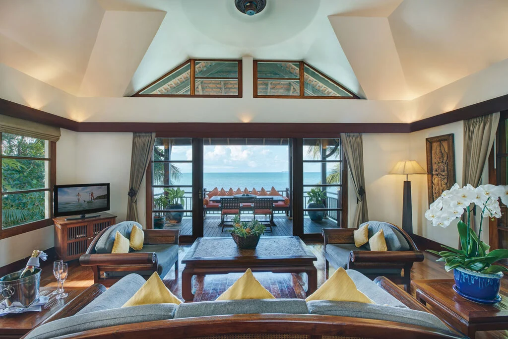 Hotel room with dark wooden interior and seaview