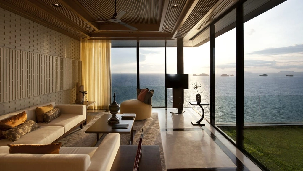 Modern Hotel Room with beige couch and seaview