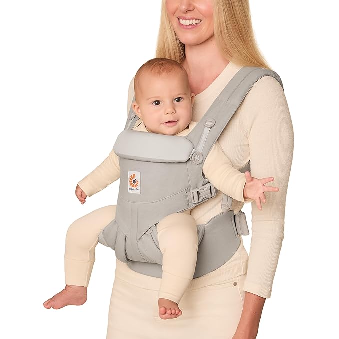 A woman carrying a baby.