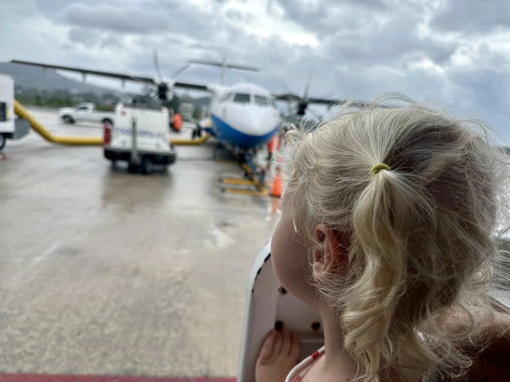 Toddler watching airplanes