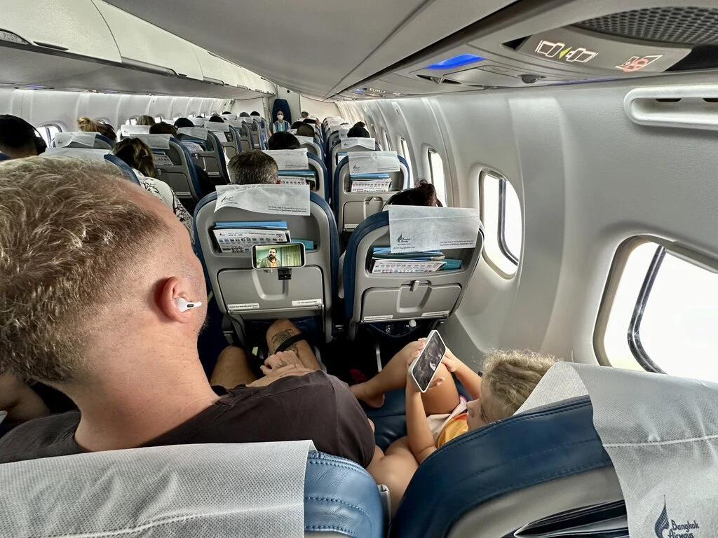 Plane Aisle view with dad and daughter