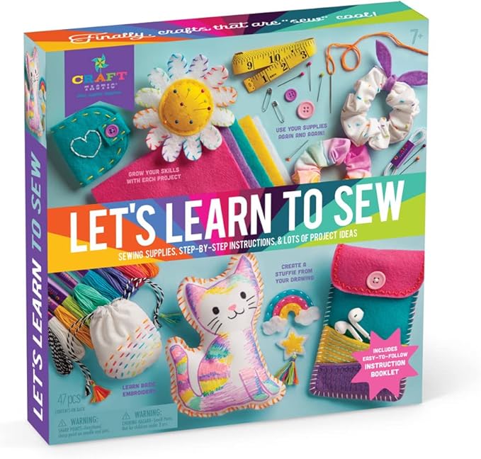 Colorful box with a little cat, sunflower and sewing equipement.