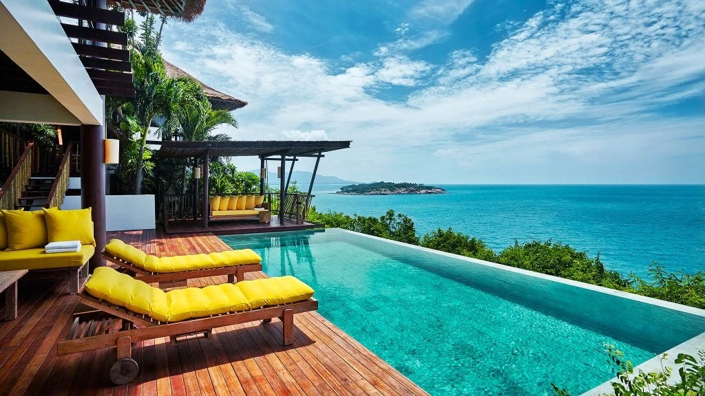 Hotel villa with yellow pillows, pool and seaview, one of the 20 best Koh Samui Lzxury Hotels