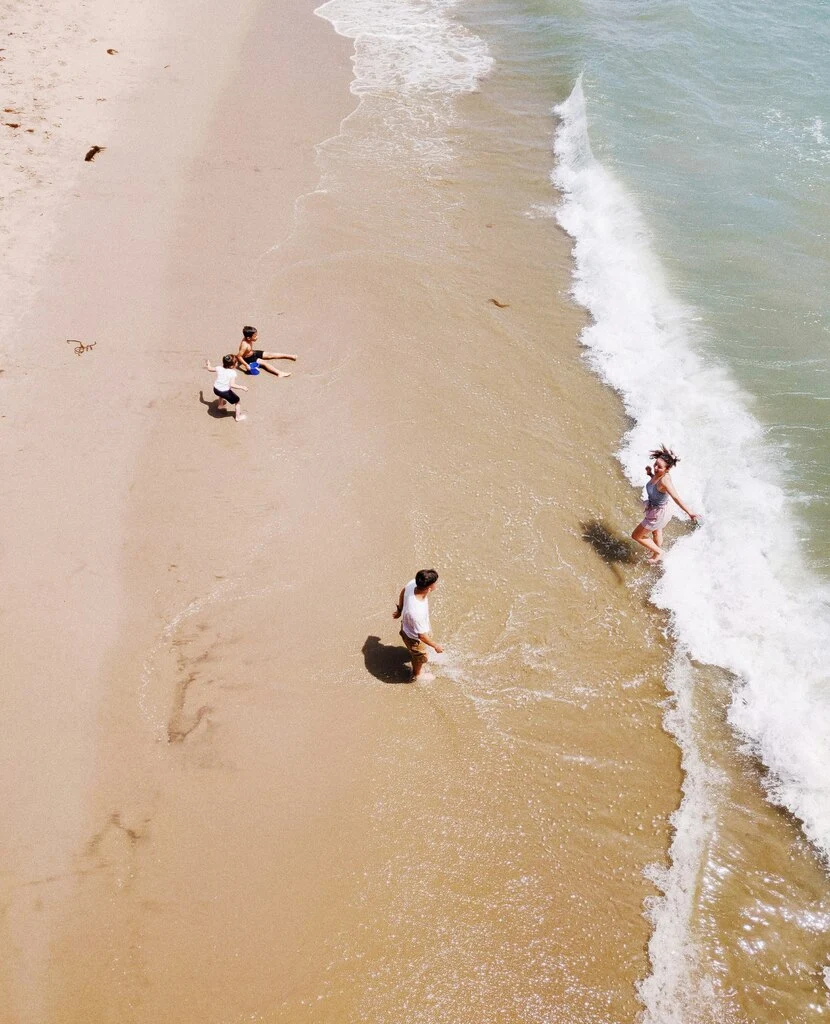 Family playing on the beach, best beach activities for kids