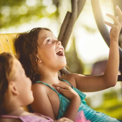 Two girls in a car, travel activities for kids