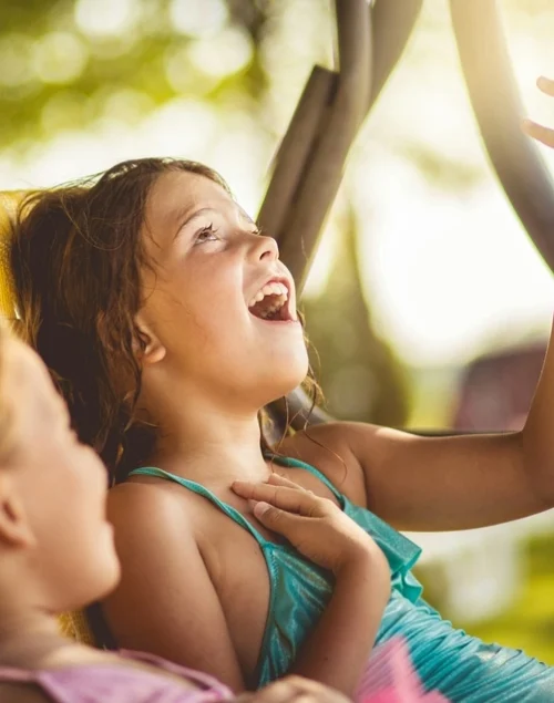 Two girls in a car, travel activities for kids