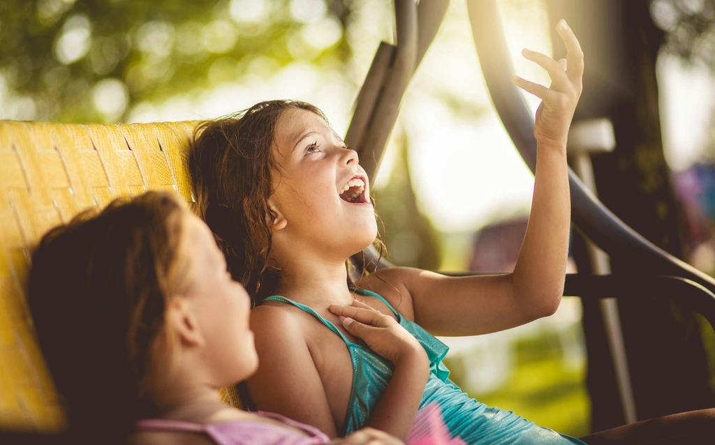 Two girls in a car, travel activities for kids