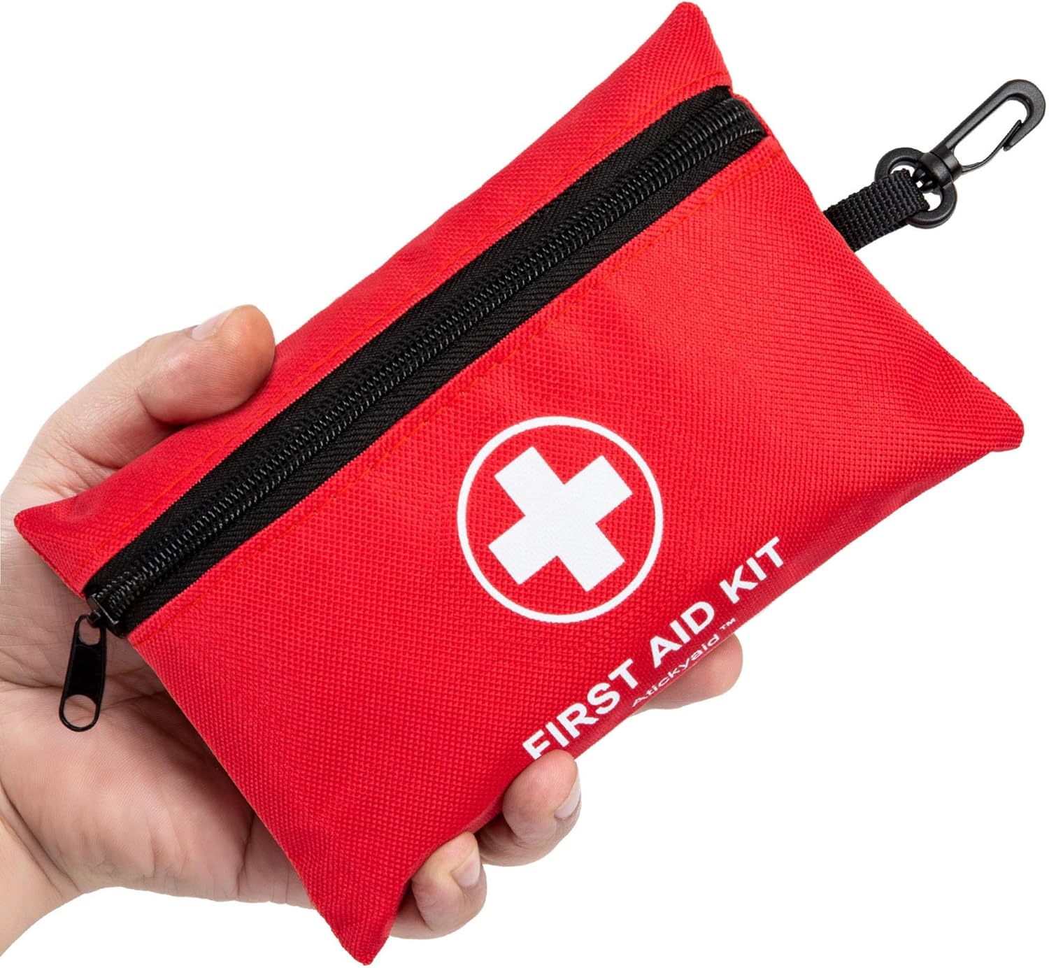 Hand holding a red first-aid-kit.