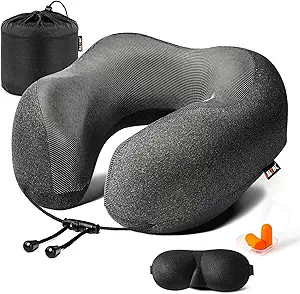 55 Best Movies to Watch on a Plane (2025 Update) 6 Black neck pillow with eye mask and earplugs.