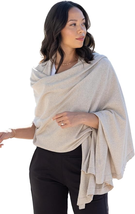 Brunette woman wearing a beige scarf.
