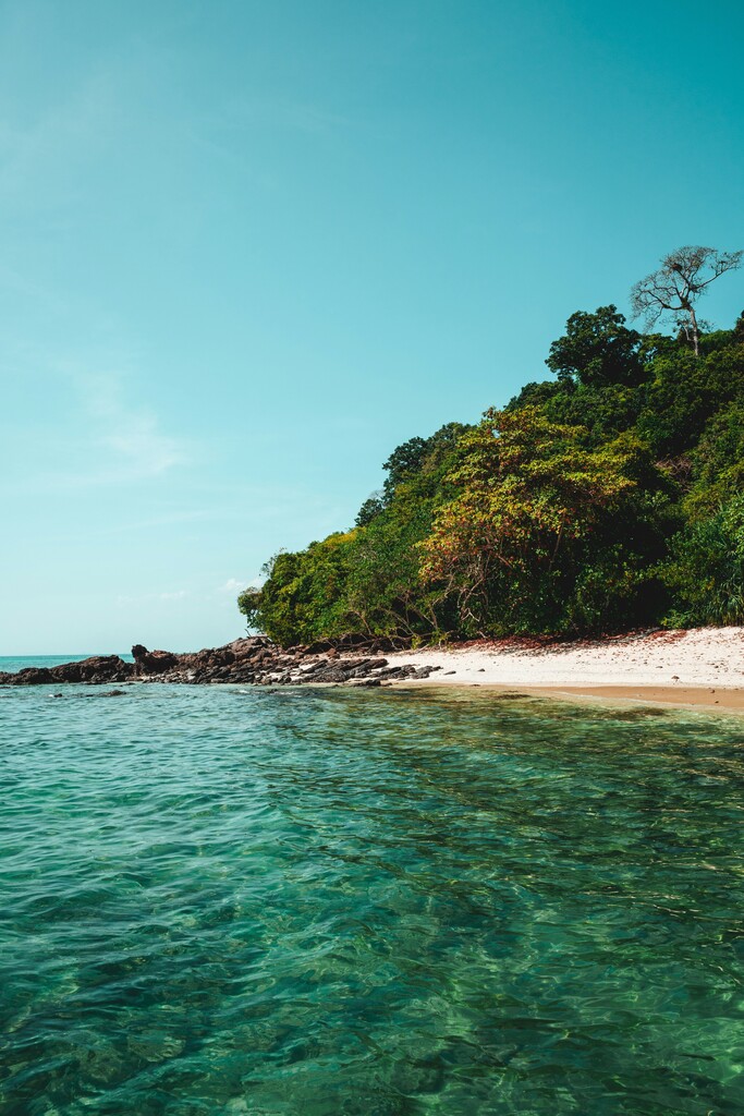 Tropical beach with Thai longtail boats.