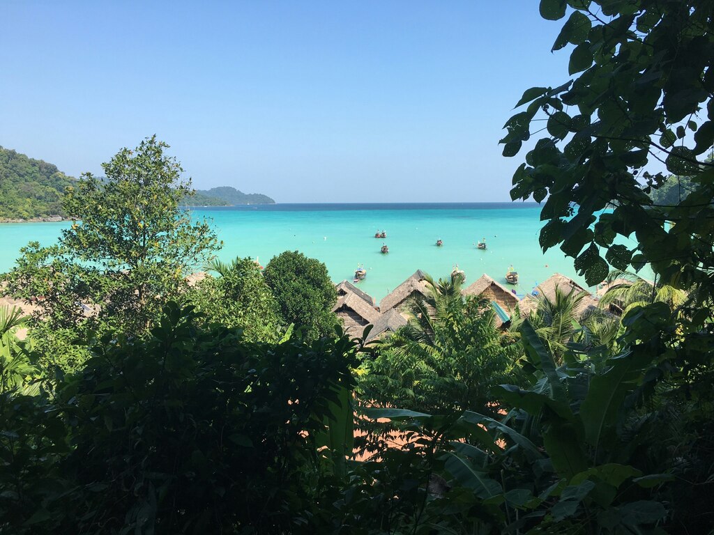 Tropical beach with beach huts.