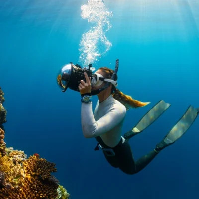 Female Scuba Diver with camera, best scuba diving in Thailand