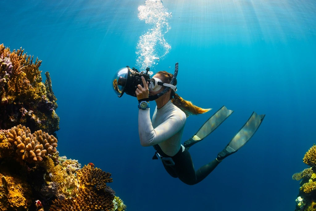 Female Scuba Diver with camera, best scuba diving in Thailand