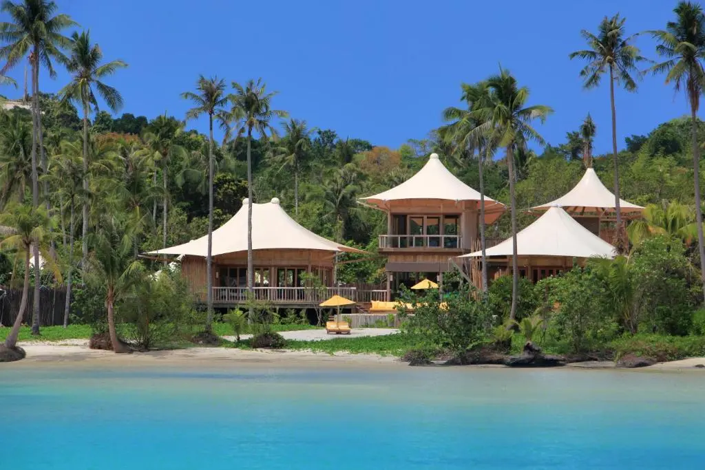 Small hotel bungalows sitting in lush jungle with private beach.