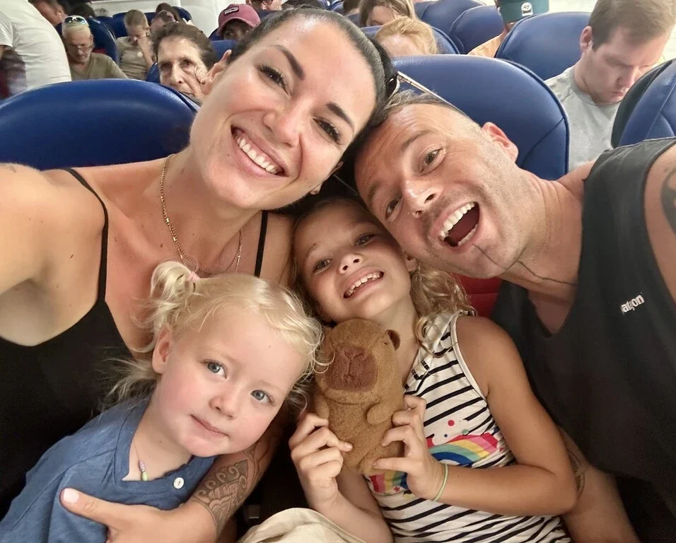 31 Healthy Travel Snacks for Kids (100% Veggie) 24 Family of four sitting in a plane.