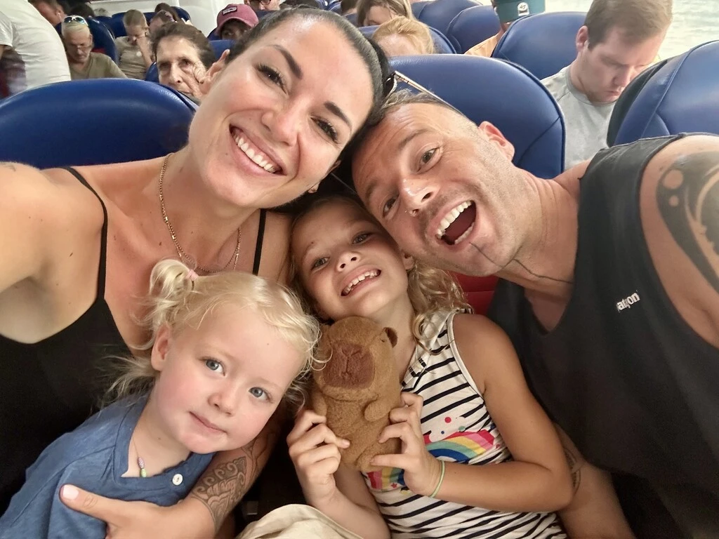 Family of four sitting in a plane.