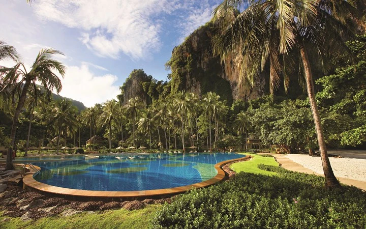 Big Pool, surrounded by limestone cliffs and palm trees.