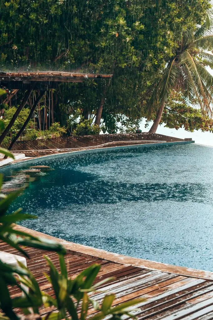 Pool in resort during heavy rainfalls. Best months to visit Thailand.