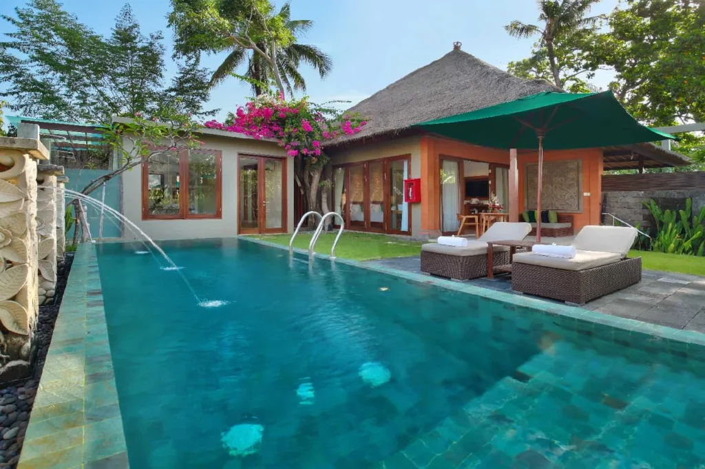 A swimming pool with a waterfall.