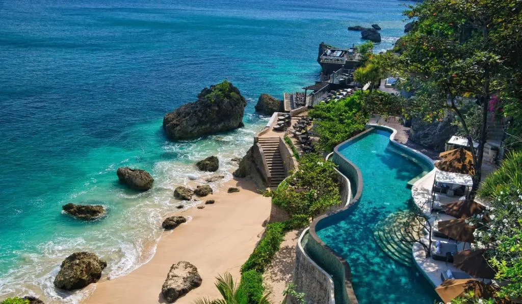 A swimming pool on a beach.