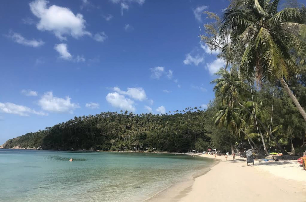 Long stretch of white sand beach.