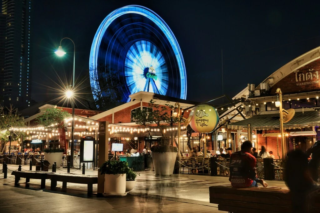 7-Day Thailand Family Trip: 2 Perfect Itinerary Ideas 2 A ferris wheel in the background and a restaurant in the front. 7-Day Thailand Family Trip