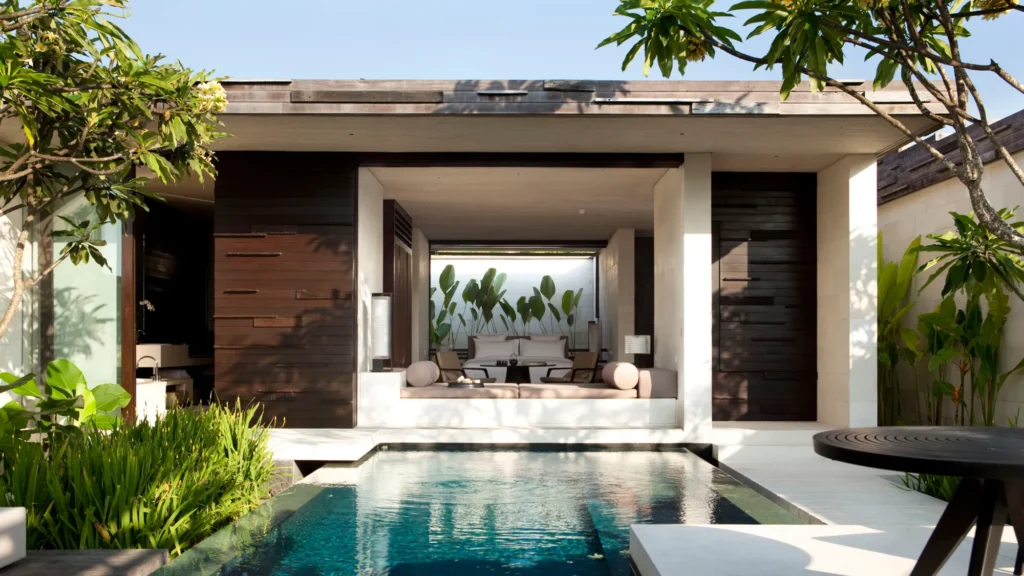 A private pool villa with open living room and white sofa.