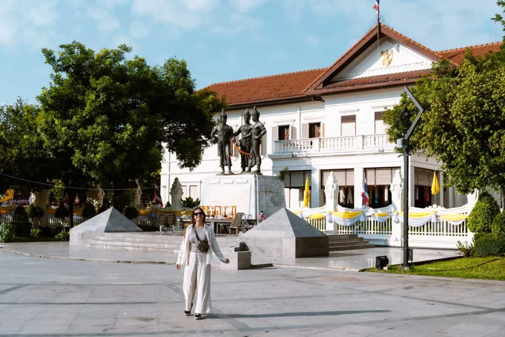 Ultimate 3-Day Chiang Mai Itinerary for First Timers 3 A woman walking in front of a white building. 3-day Chiang Mai Itinerary.