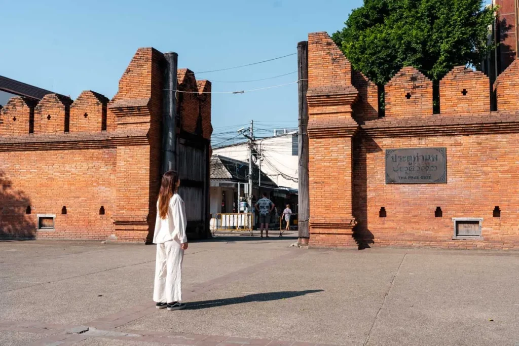 Ultimate 3-Day Chiang Mai Itinerary for First Timers 4 A woman standing in front of a brick wall.