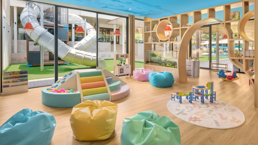 Hyatt Regency Phuket with Kids – My Honest Review 5 A wooden playroom with colorful toys and a slide.