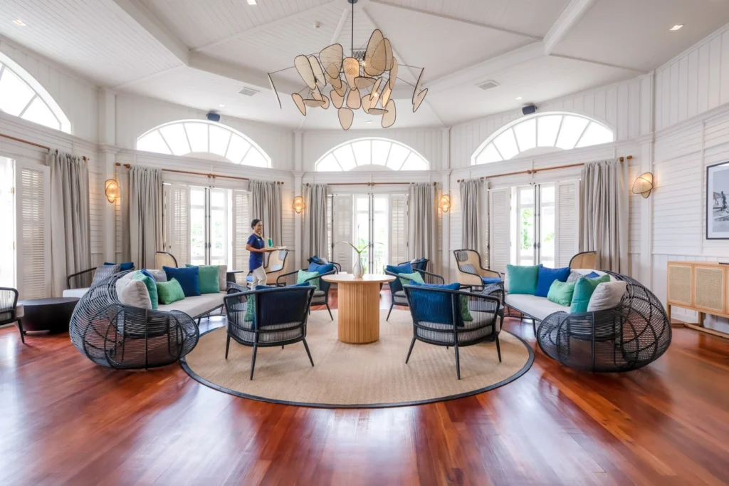 A room with a round table and chairs.