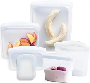 A group of plastic containers with fruit in them.