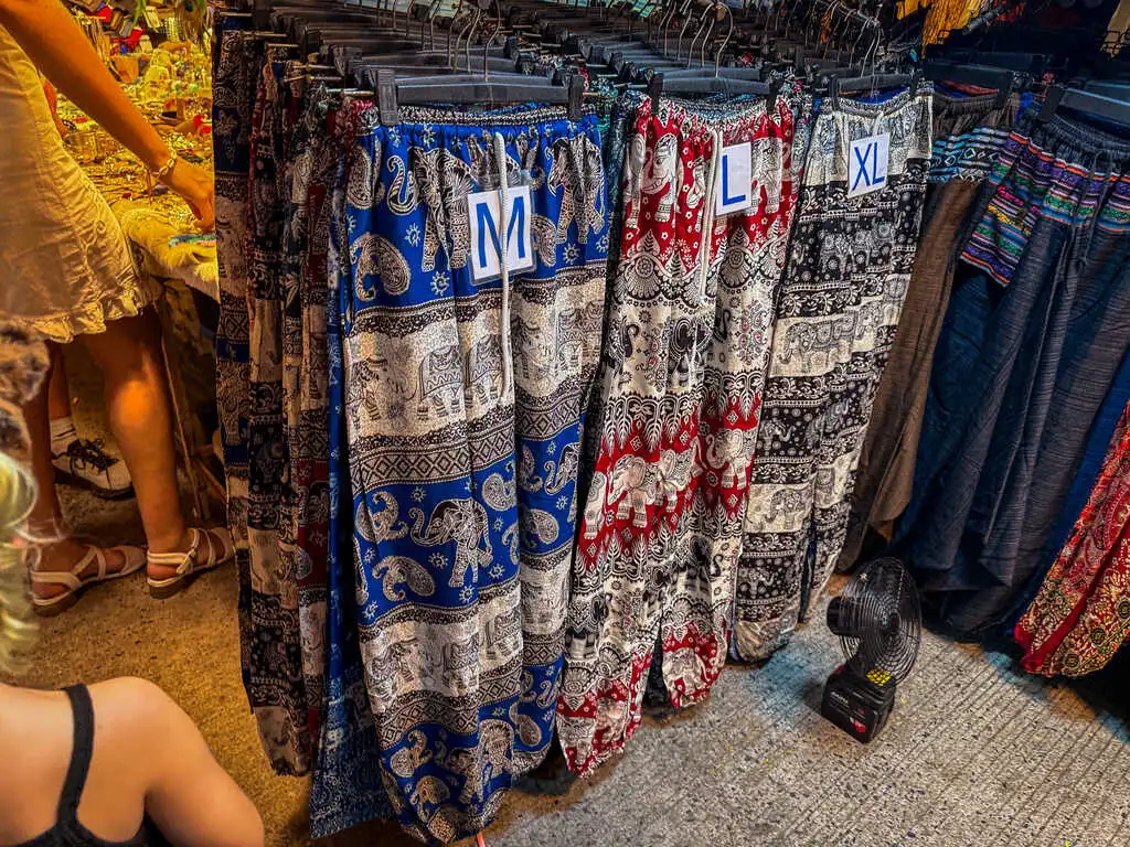 A group of pants with different designs on swingers.