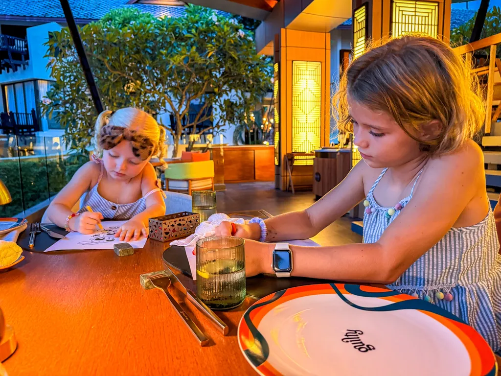 Anantara Bophut Koh Samui – Honest Family Review 2025 24 Two girls sitting at a table and drawing.
