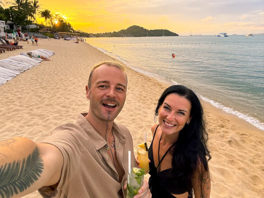 Anantara Bophut Koh Samui – Honest Family Review 2025 22 A man and woman taking a selfie on a beach.