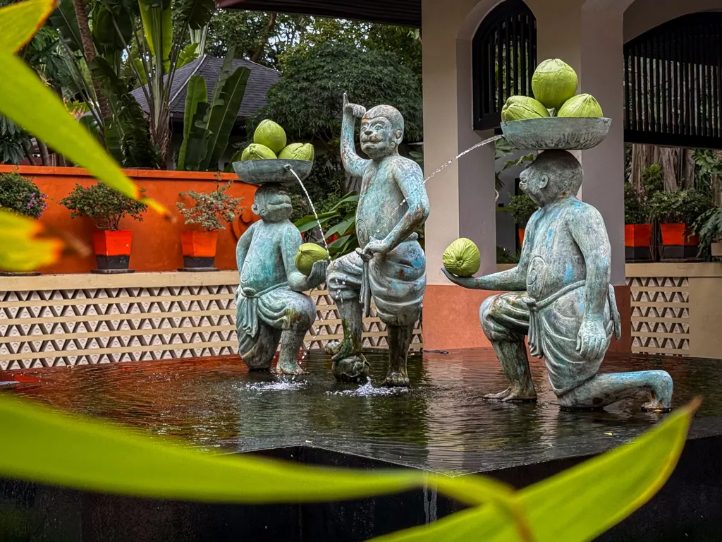 Anantara Bophut Koh Samui – Honest Family Review 2025 3 A statue of a monkey holding fruit on his head.