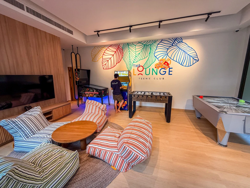 Anantara Bophut Koh Samui – Honest Family Review 2025 13 A room with a game table and couches, a teens club.