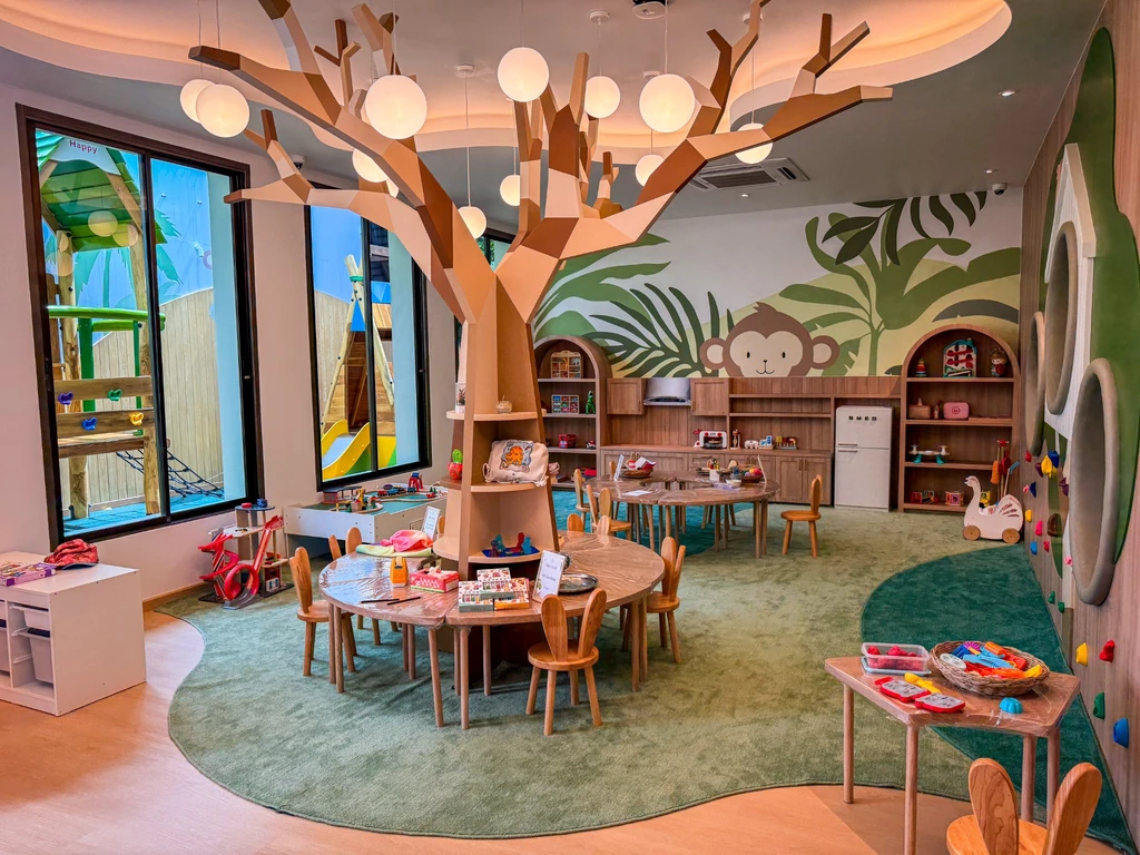 Anantara Bophut Koh Samui – Honest Family Review 2025 10 A room with a tree and tables and toys.