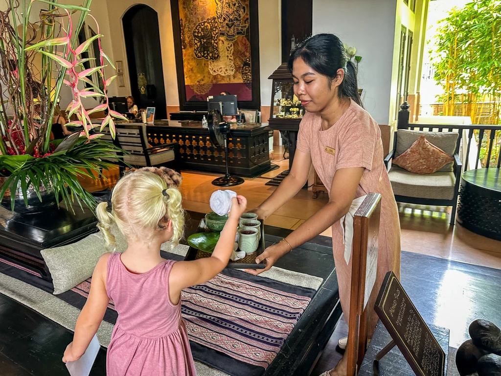 Anantara Bophut Koh Samui – Honest Family Review 2025 4 A woman serving a child.