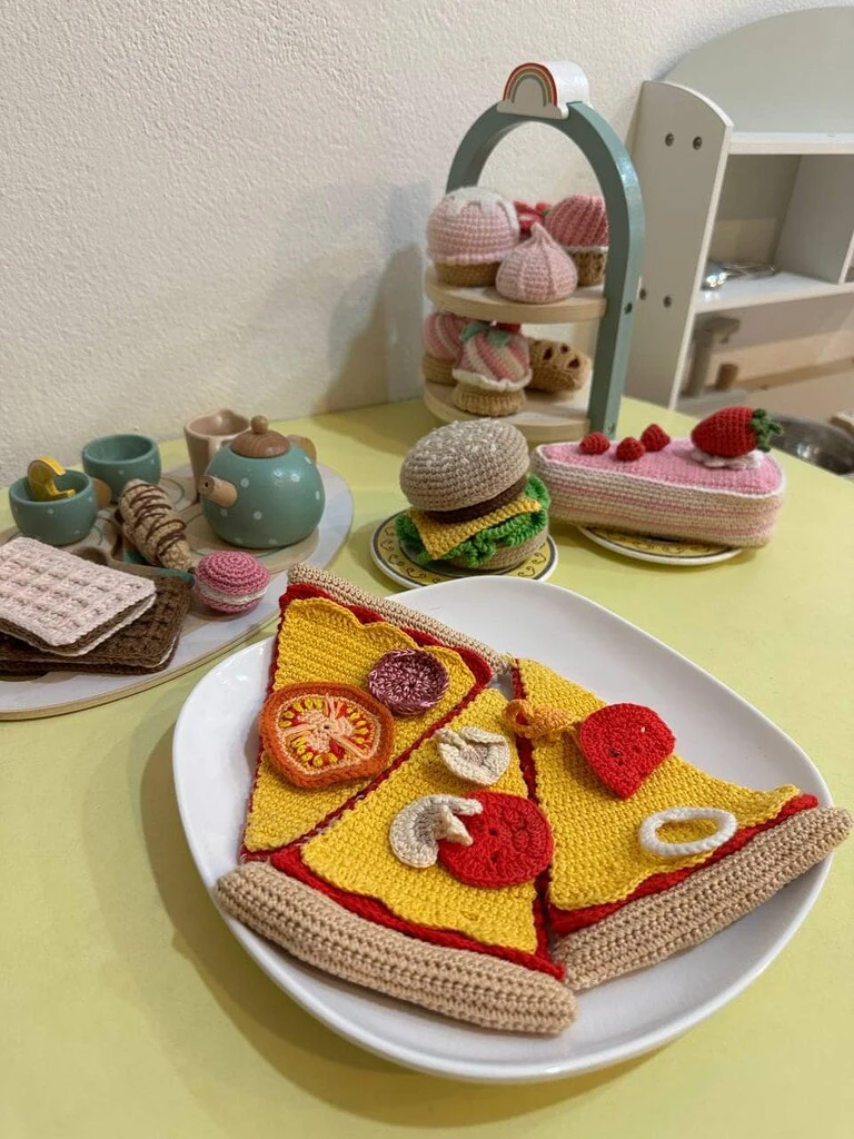Top 10 Indoor Playgrounds in Koh Samui – Rainy Day Tips 15 A plate of food toys on a table.
