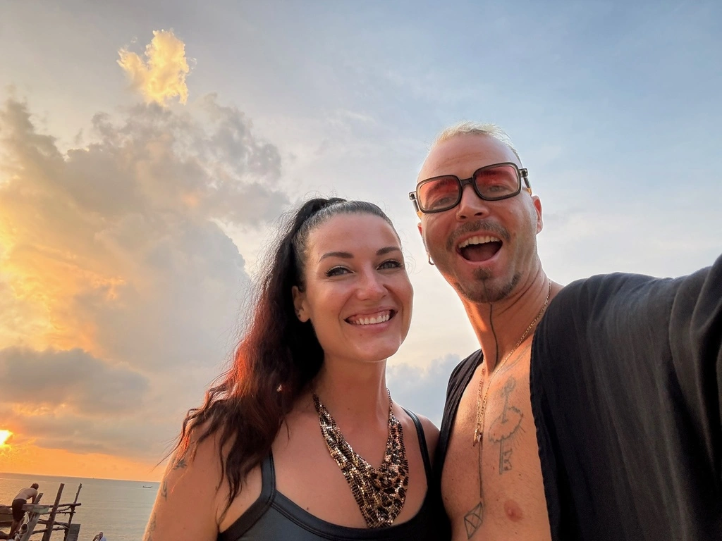 A man and woman taking a selfie.