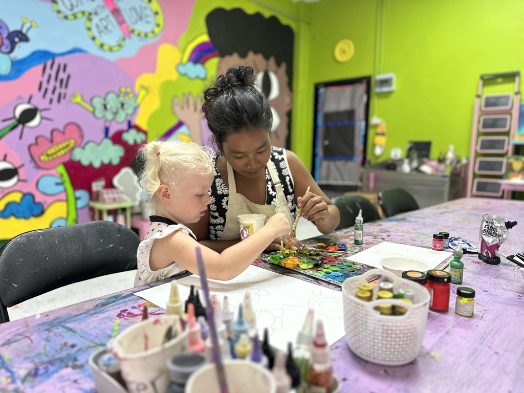 Koh Samui with Kids: 25 Super Fun Things to Do in 2025 9 A woman and a child painting at Art in Paradise, one of the best things to do in Koh Samui with kids.