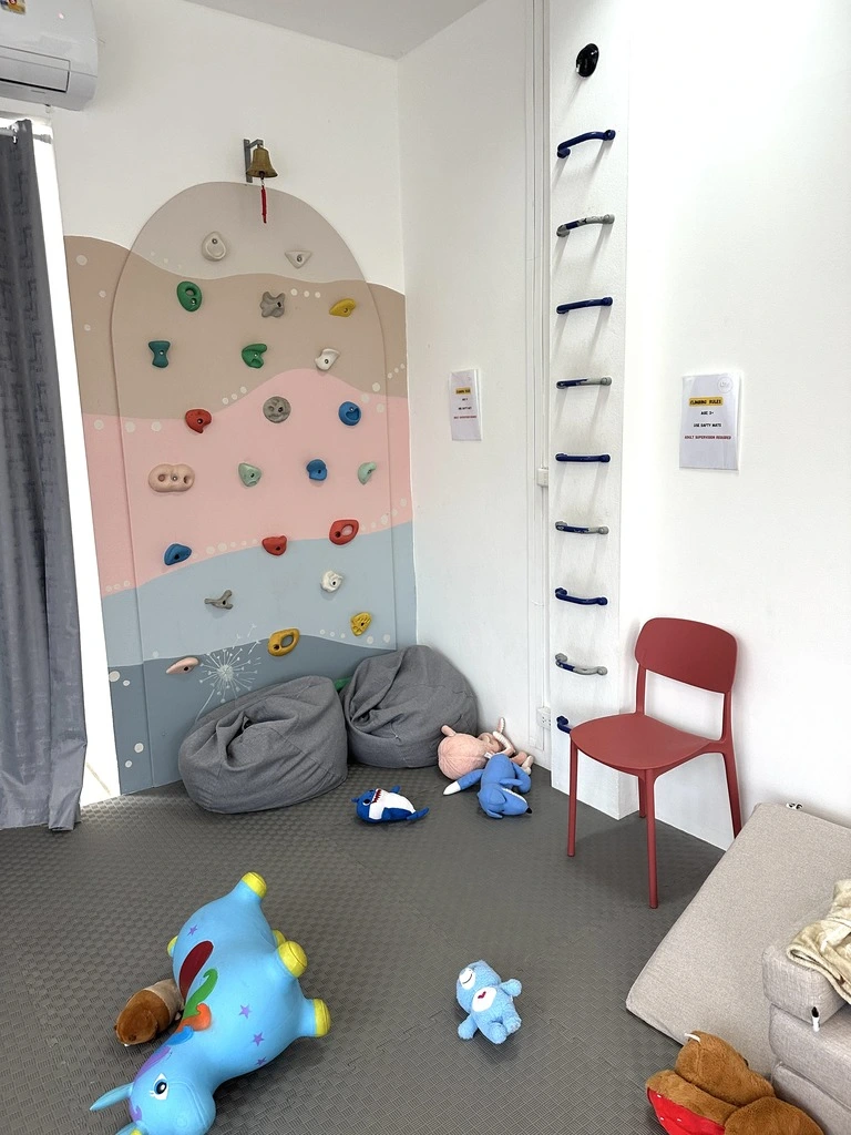Top 10 Indoor Playgrounds in Koh Samui – Rainy Day Tips 30 A colorful climbing wall.
