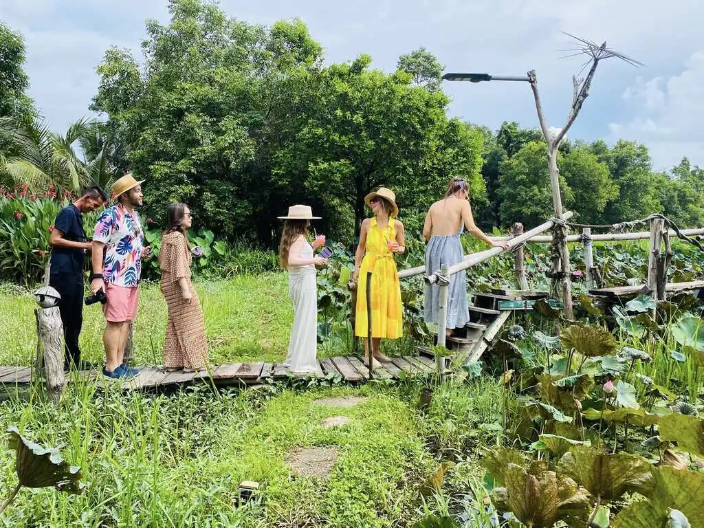 Koh Samui with Kids: 25 Super Fun Things to Do in 2025 18 A group of people walking on a wooden walkway in nature at The Nature Samui.